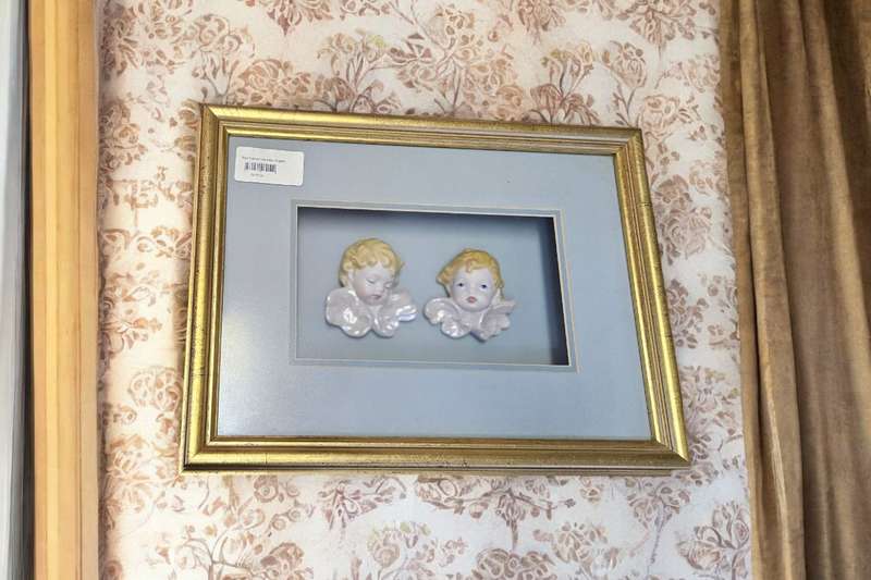 Exquisite boxed frame featuring delicate porcelain angels