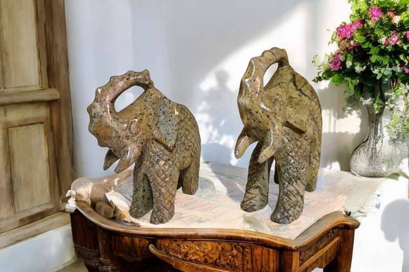 Pair of heavy hand-carved stone elephants