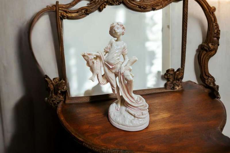 Le Ron stone-lite ornamental display figurine of a young boy