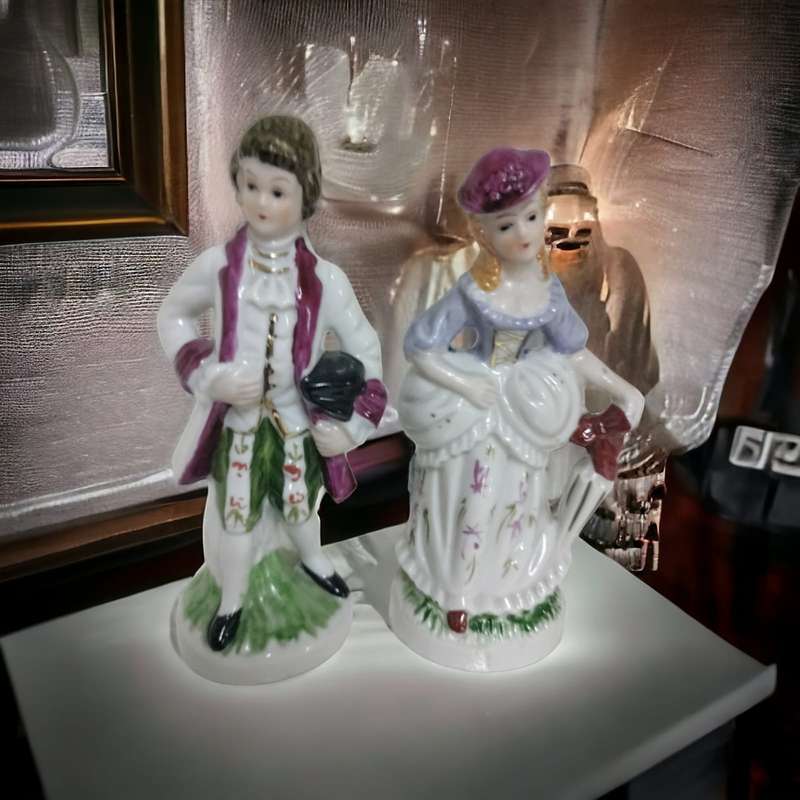 Exquisite Antique Victorian Couple Porcelain Figurines. Crafted with intricate details.