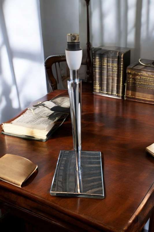 Illuminate your space with this elegant and modern 46cm Silver Metal Table Lamp
