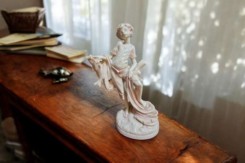 Le Ron stone-lite ornamental display figurine of a young boy