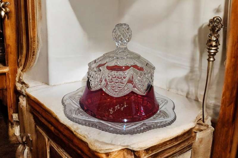 Exquisite antique souvenir butter/cheese dish features a stunning ruby stained glass