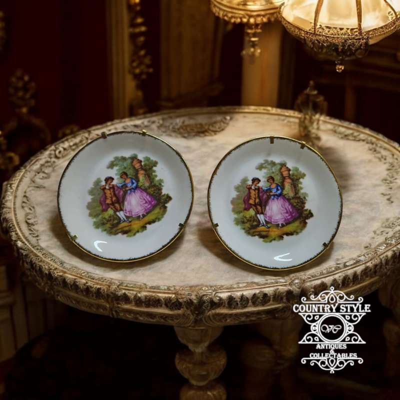 Pair of Goudeville Limoges plates on stands