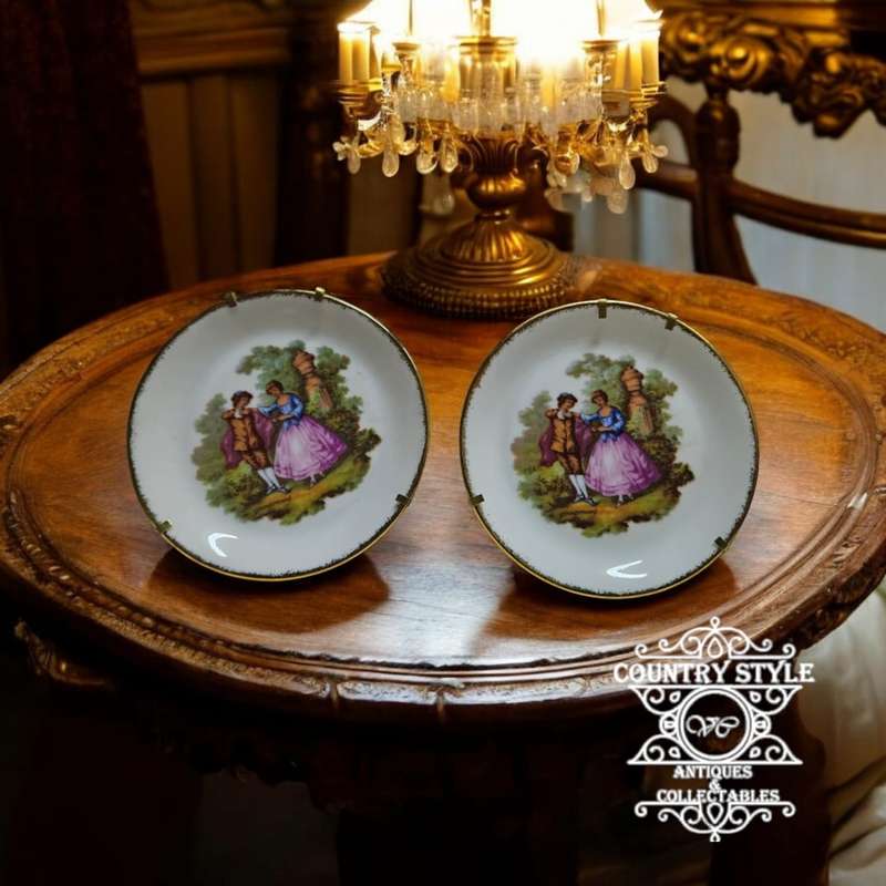 Pair of Goudeville Limoges plates on stands