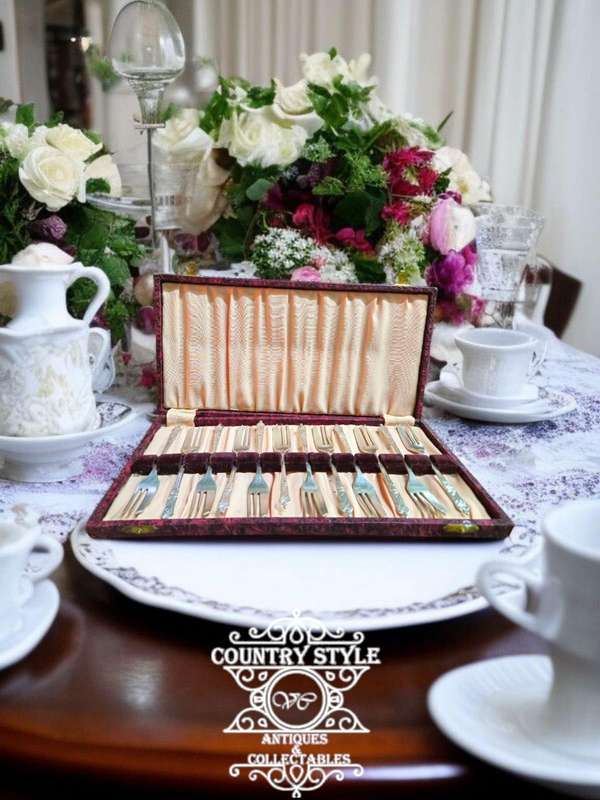 12-piece set of vintage apostle cake forks