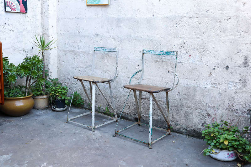 A pair of antique vintage Industrial worker chairs