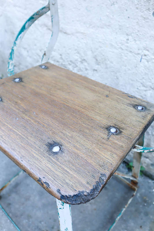 A pair of antique vintage Industrial worker chairs