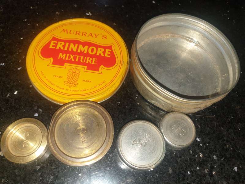 4 old tradition scale weights in tin