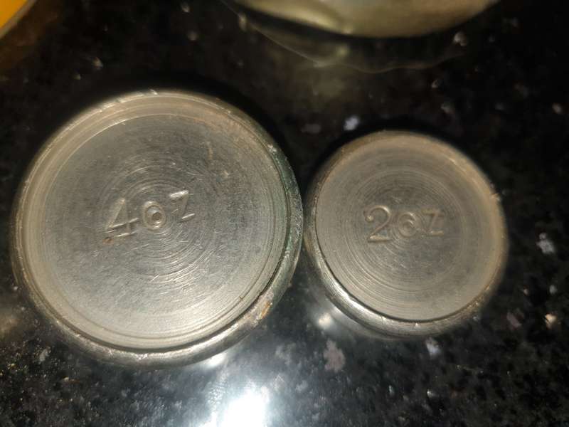 4 old tradition scale weights in tin