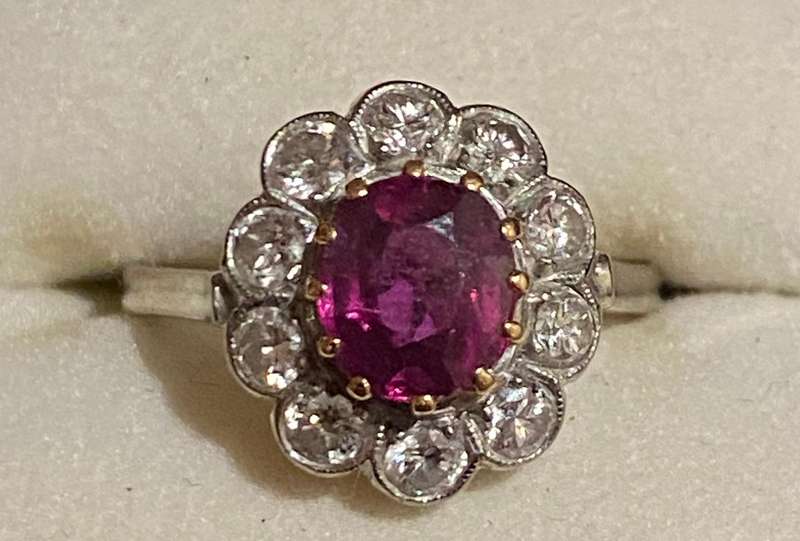 Ruby and approx. 1/2 carat Diamond Flower shaped ring on 18ct white gold