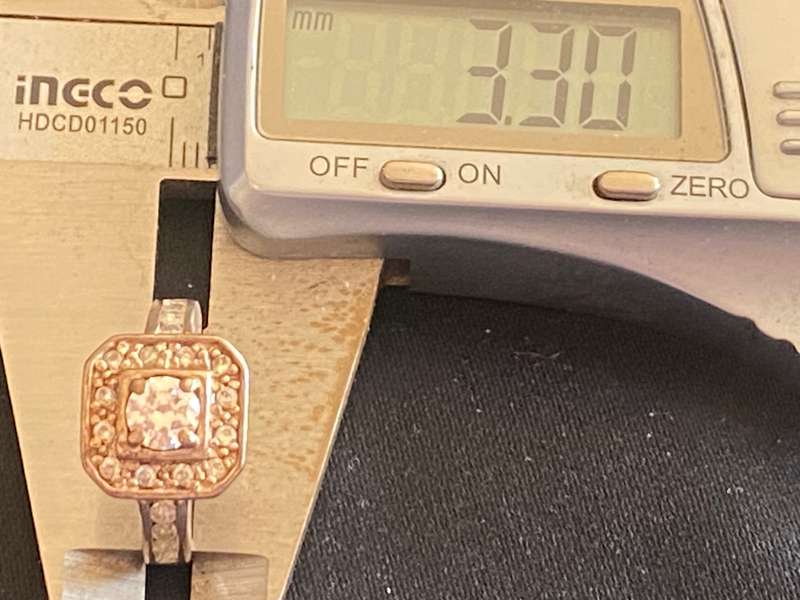 Stunning sterling  Silver with large CZ and more CZ's  in a square and down side Ring