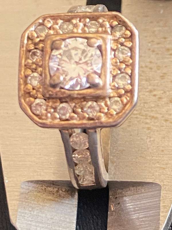 Stunning sterling  Silver with large CZ and more CZ's  in a square and down side Ring