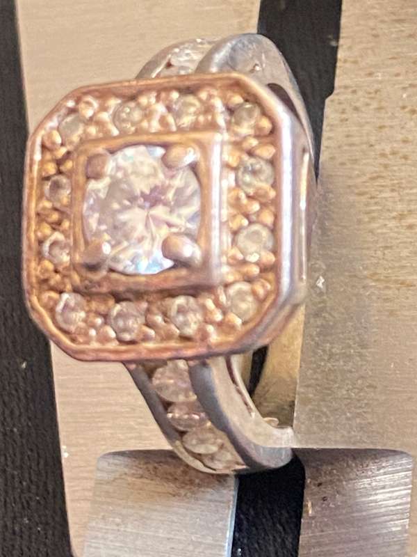 Stunning sterling  Silver with large CZ and more CZ's  in a square and down side Ring