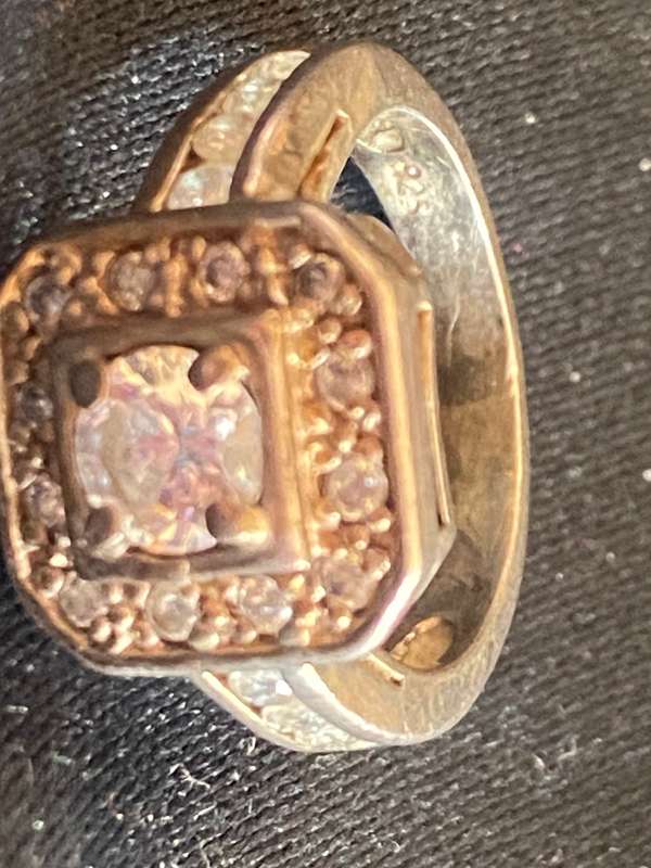 Stunning sterling  Silver with large CZ and more CZ's  in a square and down side Ring