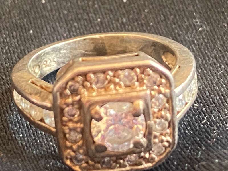 Stunning sterling  Silver with large CZ and more CZ's  in a square and down side Ring