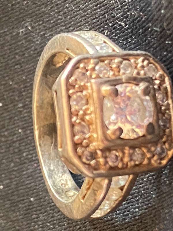 Stunning sterling  Silver with large CZ and more CZ's  in a square and down side Ring
