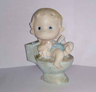 Boy on toilet figurine