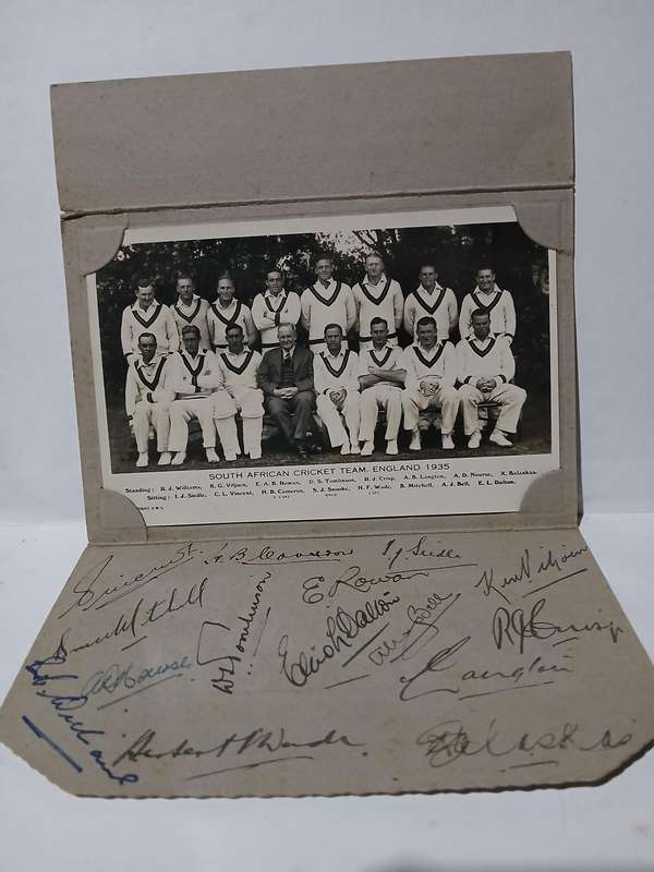 Real picture postcard of South African cricket team 1935 with full autograph sheet