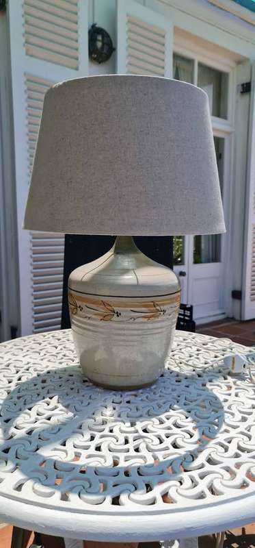 Lamp. Fabulous contemporary ceramic lamp shaped like a vintage bottle. Includes lampshade.