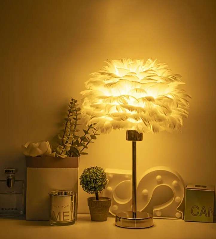 Stunning warm, luxurious table lamp with a soft white shade and adjustable brightness and lighting.