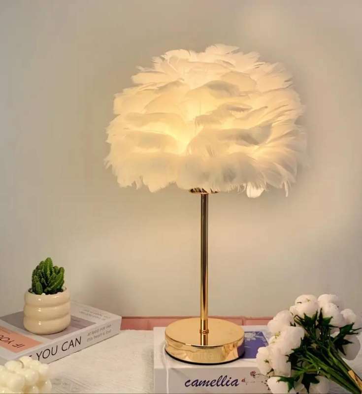 Stunning warm, luxurious table lamp with a soft white shade and adjustable brightness and lighting.
