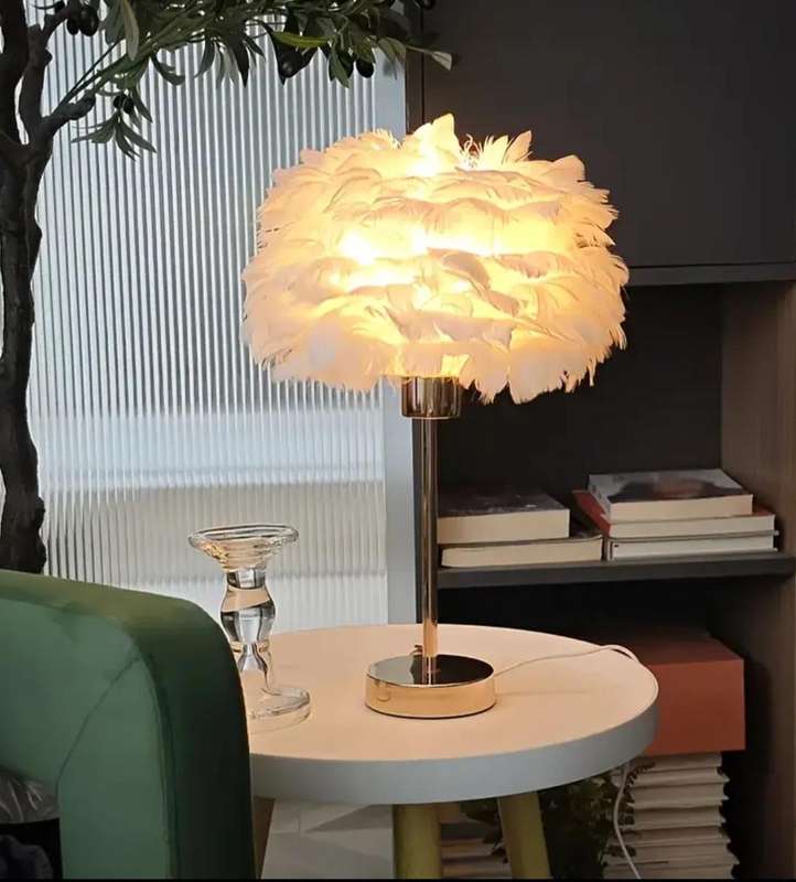 Stunning warm, luxurious table lamp with a soft white shade and adjustable brightness and lighting.