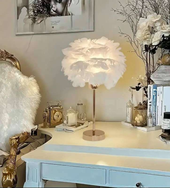 Stunning warm, luxurious table lamp with a soft white shade and adjustable brightness and lighting.