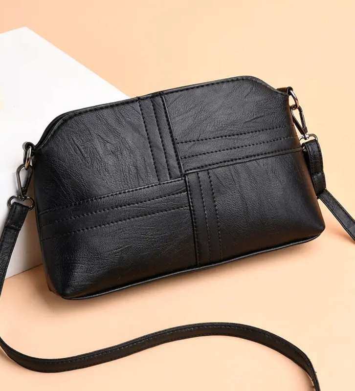 Woman's shoulder sling handbag