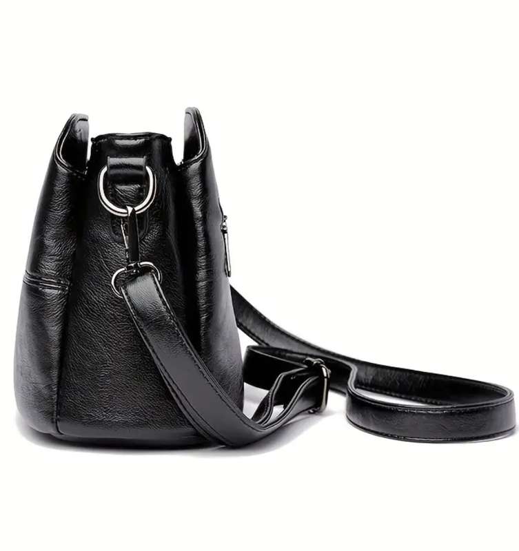 Black shoulder sling handbag