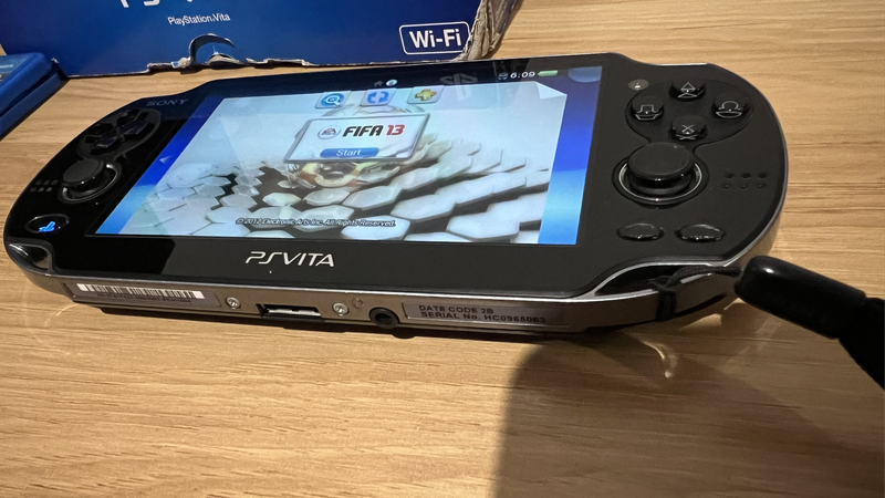 PS Vita (OLED)  Boxed + 2 Games