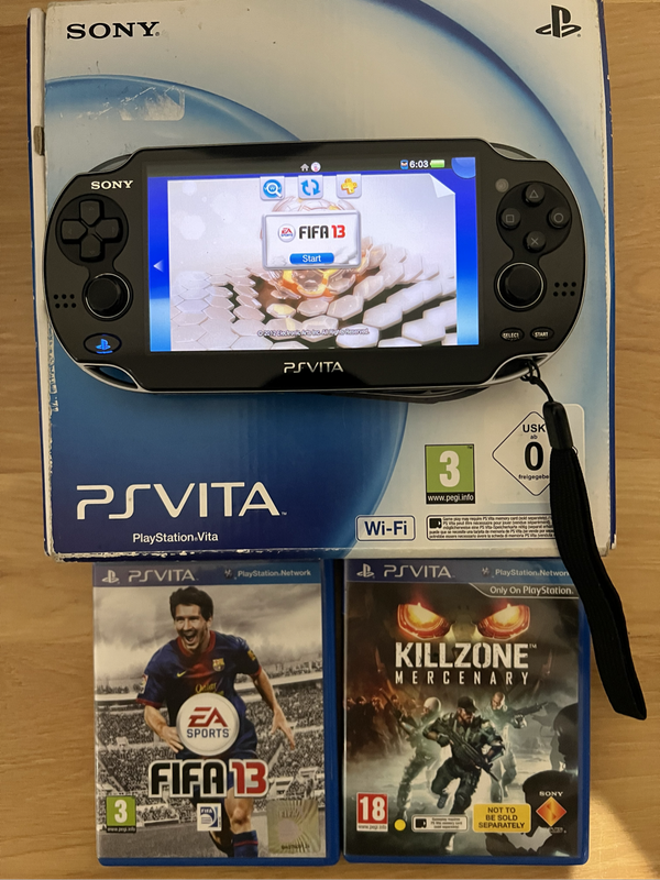 PS Vita (OLED)  Boxed + 2 Games