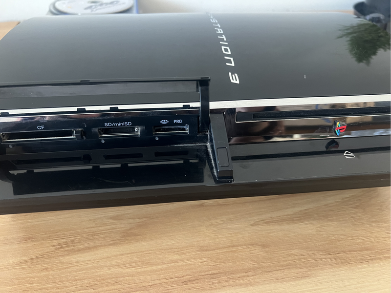 PlayStation 3 First Edition (Backwards Compatible)  Bundle | Includes 2 PS3 Games + 1 PS2 Game + 2