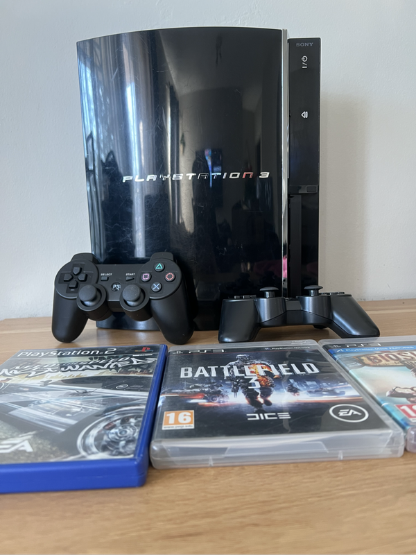 PlayStation 3 First Edition (Backwards Compatible)  Bundle | Includes 2 PS3 Games + 1 PS2 Game + 2
