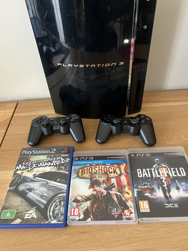 PlayStation 3 First Edition (Backwards Compatible)  Bundle | Includes 2 PS3 Games + 1 PS2 Game + 2