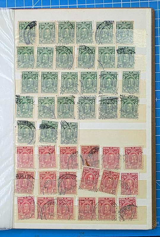 Stock Book: Old Medium 8/16 White Page with Used Rhodesia & Postmarks: Possible Finds!