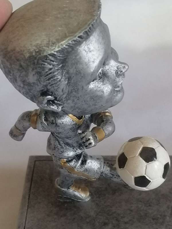 Resin kicking, Bubble head soccer trophy in unused condition.