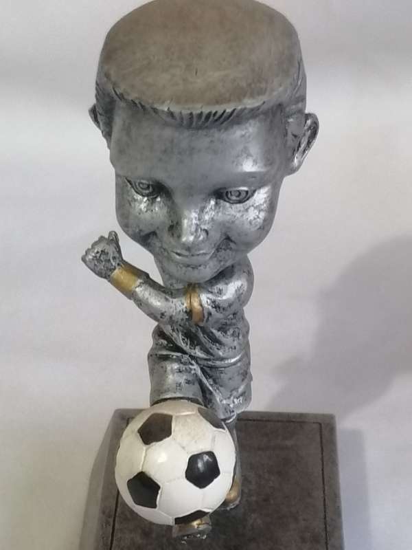 Resin kicking, Bubble head soccer trophy in unused condition.