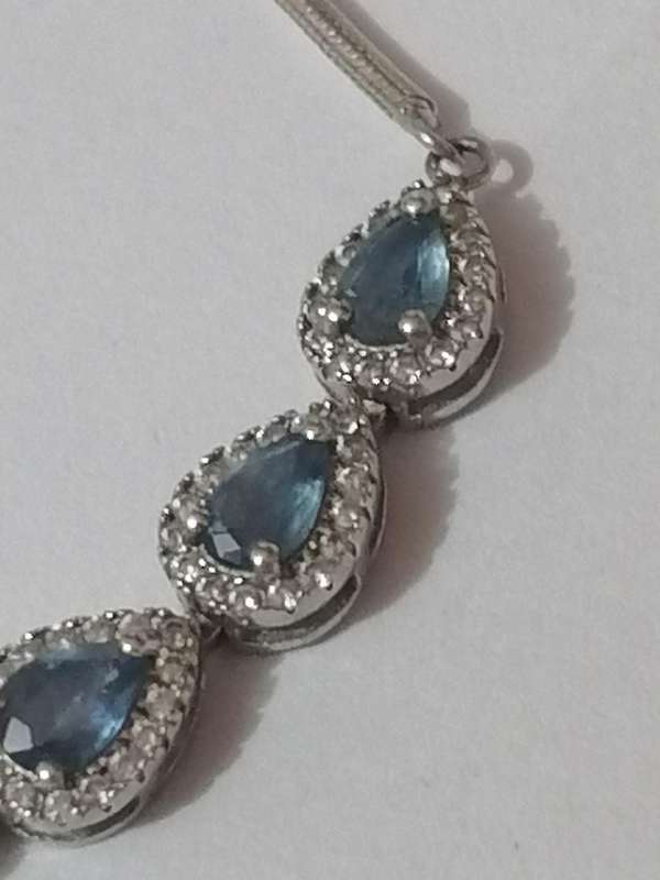 Stylish swivel locking snake chain bracelet, sterling silver with beautiful stones.