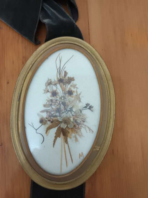 Vintage triptych wall hanging of small oval dried flower pictures