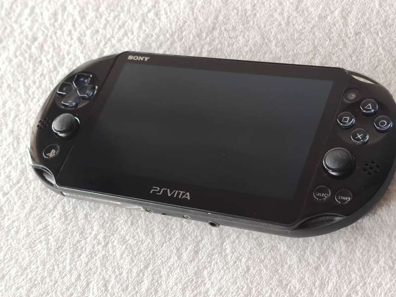 Playstation Vita Slim Console + 3 Games