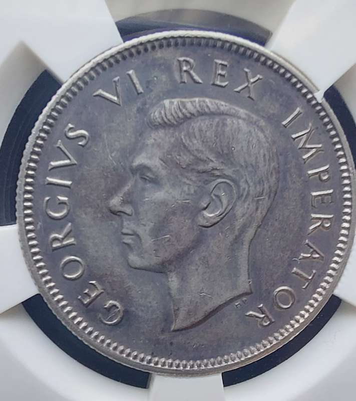 1944 shilling SANGS graded AU50. A very scarce coin!