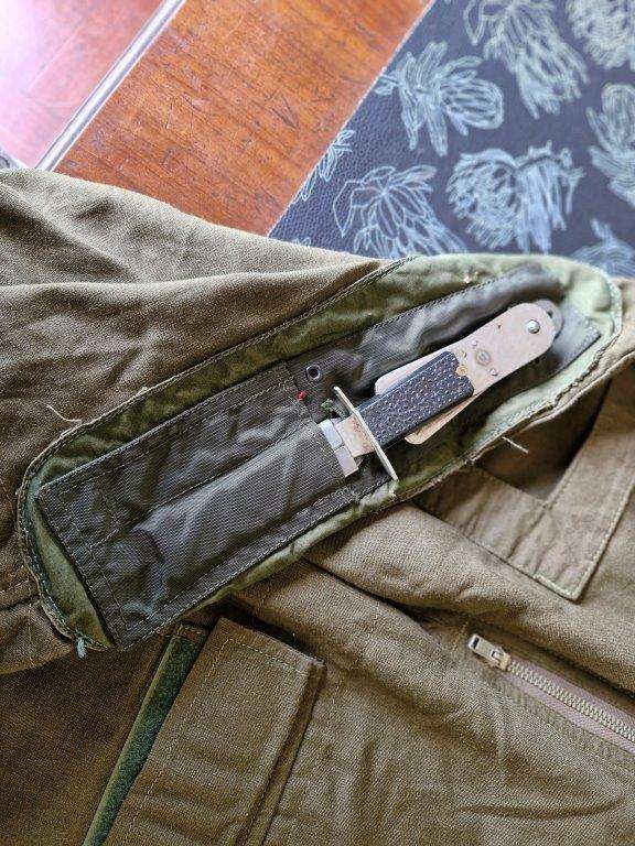 SAAF Flight Suit with survival knife. 46 Cm Armpit to Armpit. Scales one side of knife broken.
