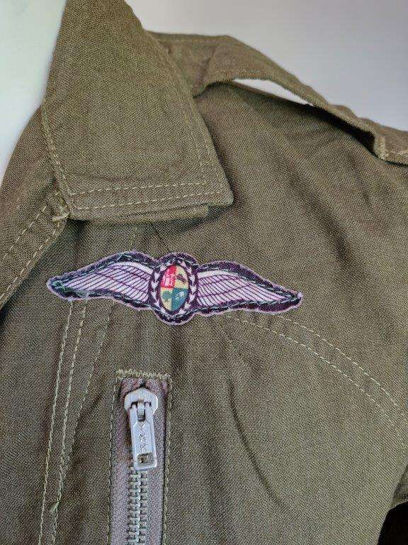 SAAF Flight Suit with survival knife. 46 Cm Armpit to Armpit. Scales one side of knife broken.
