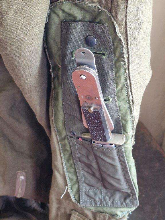 SAAF Flight Suit with survival knife. 46 Cm Armpit to Armpit. Scales one side of knife broken.