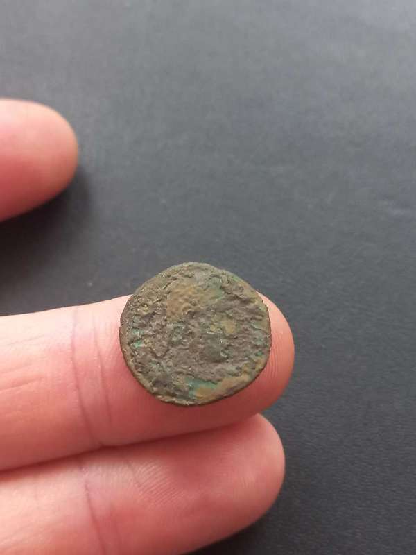 Ancient coin, uncleaned. Some detail