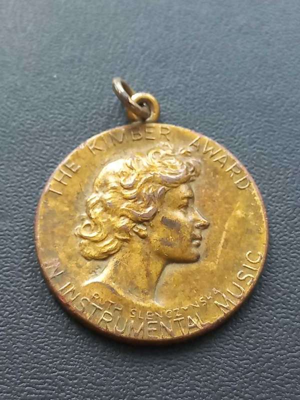The Kimber Award medal. Musical instrument