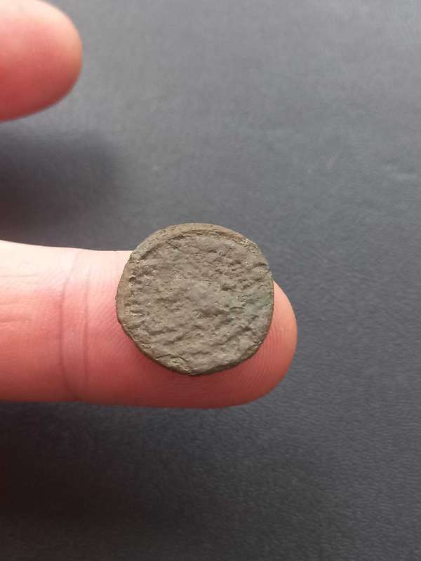 Ancient coin, uncleaned. Some detail