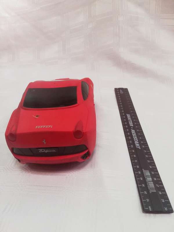 Ferrari rubber top battery operated car. Untested