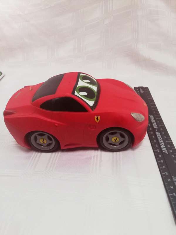 Ferrari rubber top battery operated car. Untested